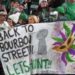 Eagles fans take to streets to celebrate team’s NFC title win; fan drops from light pole