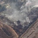 Residents evacuated as brush fire threatens homes near San Diego