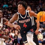 Young college basketball fan delays game after adorably storming the court: ‘Don’t know whose child that is’