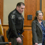 West Virginia mother on trial for locking adopted teenagers in shed denies allegations
