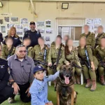 IDF, police, and Israel Dog Unit fulfill dream for child with special needs in Samaria