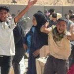 ‘Kisses for Netanyahu and Trump’: Gazans cheer as aid distribution sets off