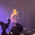 Kneecap band member charged with terrorism for displaying Hezbollah flag at concert