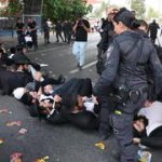 Radical Haredim block Highway 4, destroy draft notices as coalition crisis ramps up