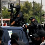 Iraqi police, paramilitary fighters clash outside government building in Baghdad