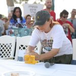 Hostage survivors, family members hold Kabbalat Shabbat outside Katz home