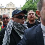 Member of Irish rap group Kneecap appears at UK court on terrorism charge