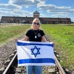 Educator harassed at Auschwitz for carrying Israeli flag: Students were the real heroes – interview