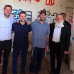Smotrich poses next to ‘death to Arabs’ graffiti in West Bank settlement