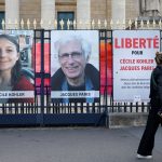 Iran releases two French nationals charged with espionage, Macron says