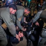 Violent clashes in Ramat Gan as protesters attack troops detaining draft-dodging yeshiva students