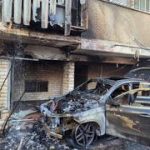 Car fire in Haifa spreads to residential building; four people, including infant, rescued