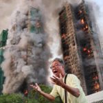 Four killed as fire rips through Hong Kong high-rise housing complex