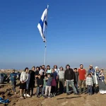Civilian activists raise Israeli flag in Gaza