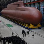 North Korea’s Kim Jong Un views submarine construction, oversees missile launch, KCNA says