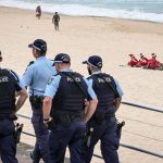 Christmas celebrations muted at Bondi as Australians grieve after deadly shooting