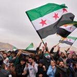 A year after Damascus fell, al-Sharaa gains global embrace as Syria reels from massacres
