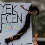 Kurdish women turn braids into symbol of resistance after Syria atrocities -explainer