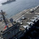 US aircraft carrier still en route to Middle East as Trump declines to say if Iran would face strike