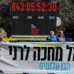 Jewish world marks first day with no hostages in Gaza by shedding their symbols of support