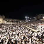 Tens of thousands at Western Wall Selichot as hostage survivors join prayer